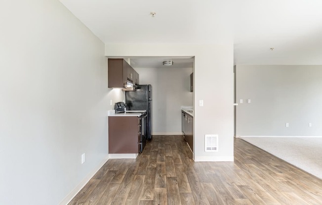 a kitchen and living room in a 555 waverly unit