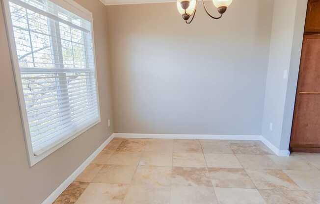 dining area with travertine in Briarwood floor plan