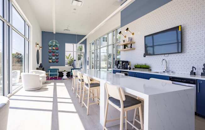 Expansive resident lounge overlooking the pool deck at The Chandler in North Hollywood