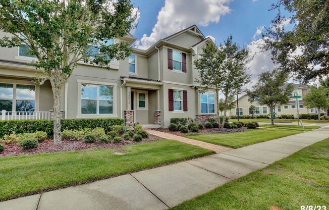 Beautifully Appointment 3/2.5 Modern Townhome with a Paved Courtyard and a Detached 2 Car Garage in the Desirable Community of Randal Park - Orlando!