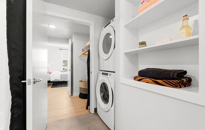 a small laundry room with a washer and dryer at Ion Town Center, Shoreline, WA