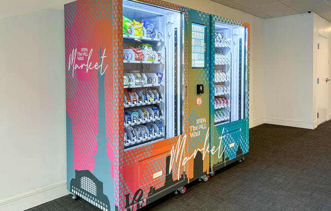 Whit Market vending machine with snacks, drinks, and convenience items at The Whit Apartments in Indianapolis, IN 46204