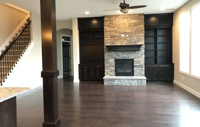 Stylish 5-Bedroom Home with Modern Kitchen, Stone Fireplace & Luxurious Primary Suite