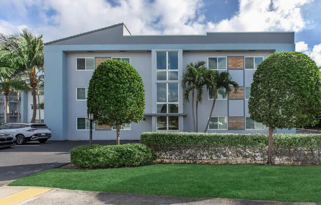 a house with a lawn in front of a building