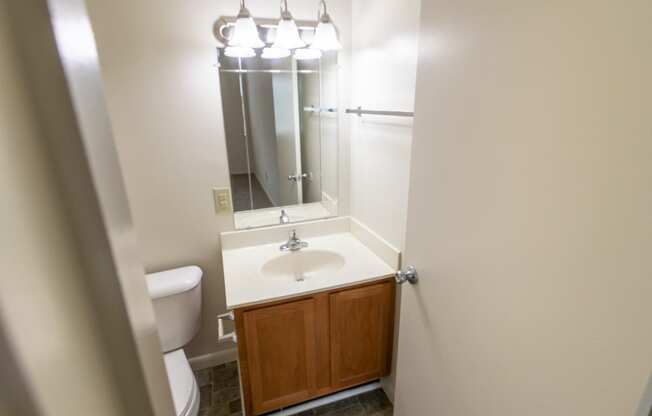 This is a photo of primary half bath in the 902 square foot, 2 bedroom, 1 and a half bath apartment at Blue Grass Manor Apartments in Erlanger, KY.