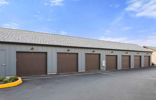 A long building with a row of garage doors.