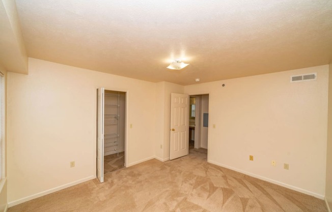 Bedroom with a door to a closet