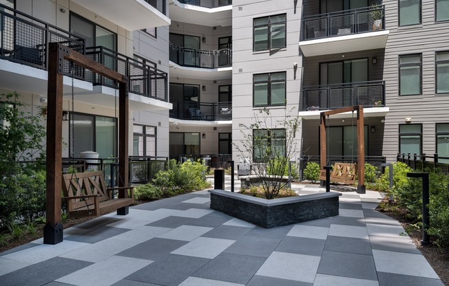 Stunning courtyard space with seating to enjoy the surrounding nature.