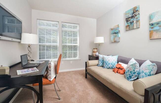 a living room with a couch and a table