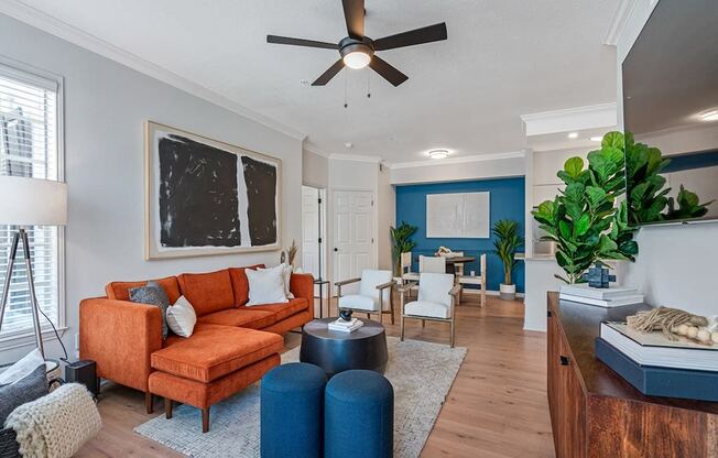 Spacious living room area with furniture and plank flooring