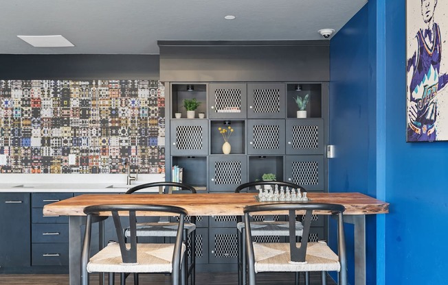 a dining room with tables and chairs and blue walls