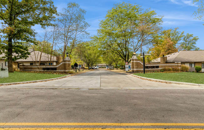a street in a neighborhood with houses and trees