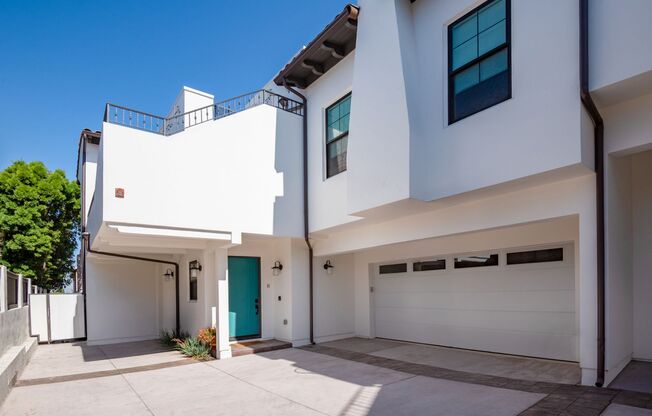 Upscale & Spacious, Spanish Style Tri-Level Townhome w/ Amazing Great Room Living Space, Rooftop Deck, 2 Balconies, Rear Yard & 2-Car Garage Close to Schools, Shopping & Just 2 Blocks to MB Border & 5 Mins to Beach!