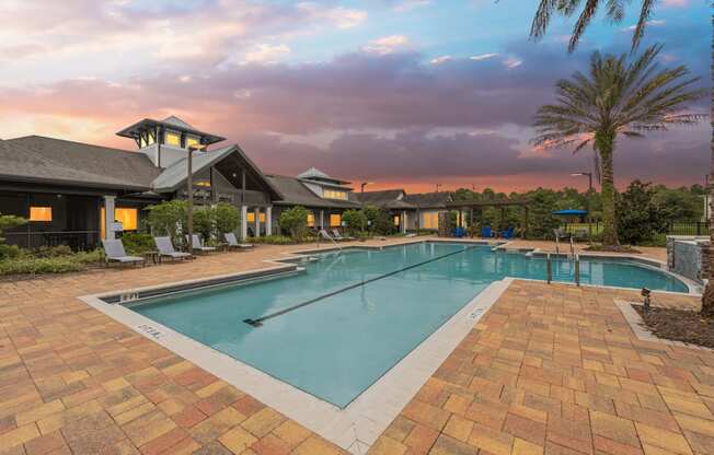 a swimming pool with a building in the background