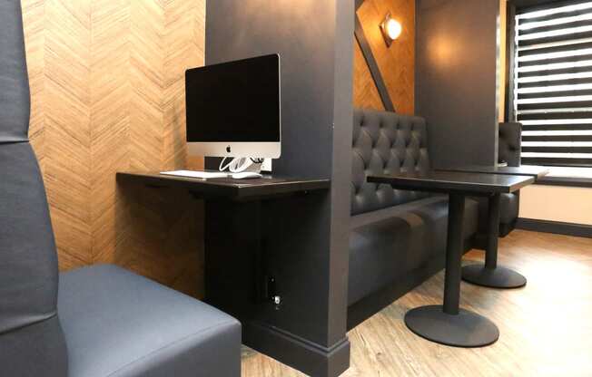 a desk with a computer and a chair in a room at Century Baxter Avenue, Kentucky, 40204