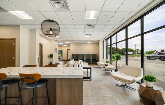 a lobby with a table and chairs and a fireplace