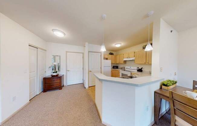 A kitchen with a counter and a sink.