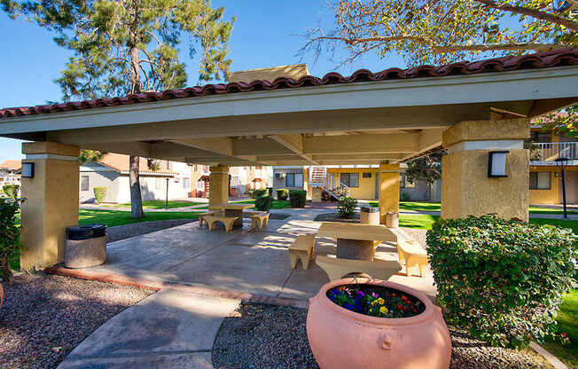 A patio area with a large planter in the center.