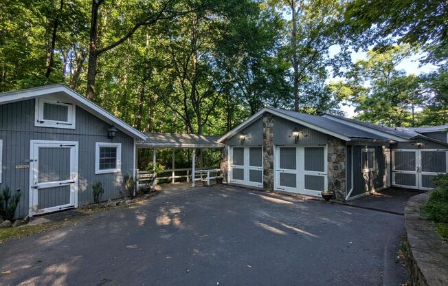 Unique Lake Lanier front home w/spectacular natural rock waterfall and dock