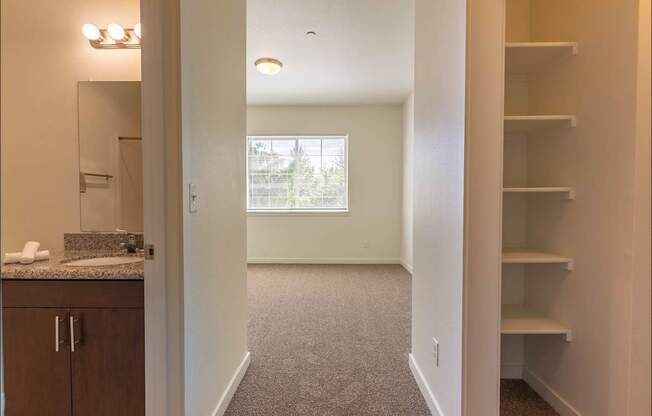 A room with a carpeted floor and a window at Riverplace Apartment Homes, Oregon, 97351