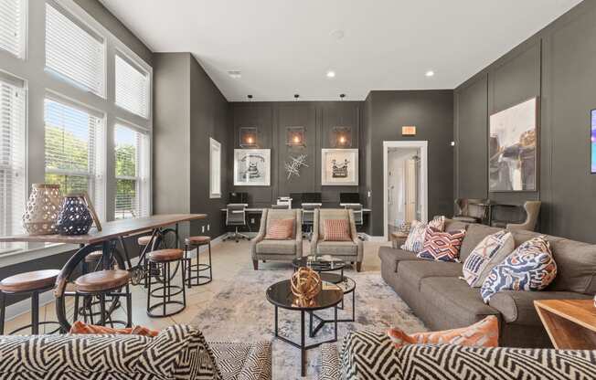 a living room with couches and chairs and a dining room table