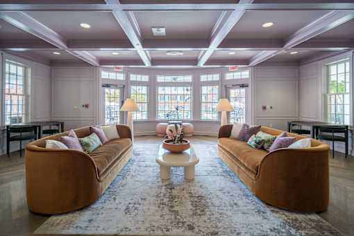 A living room with two couches and a coffee table.