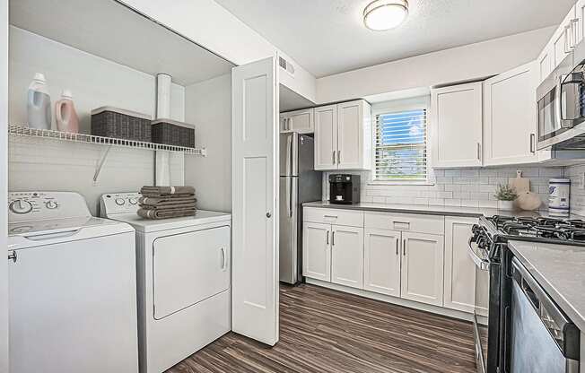 kitchen with white cabinets and stainless steel appliances at The Crossings Apartments, Michigan, 49508