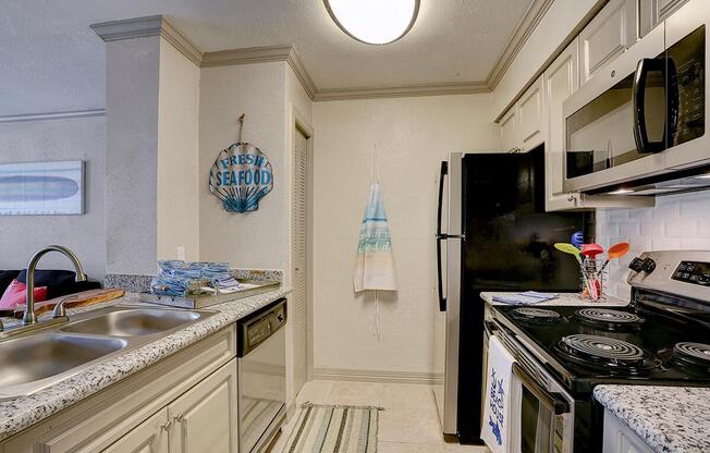 a kitchen with a stove and a sink