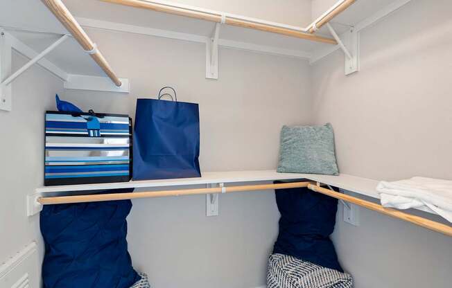 A small room with a bed and a shelf.