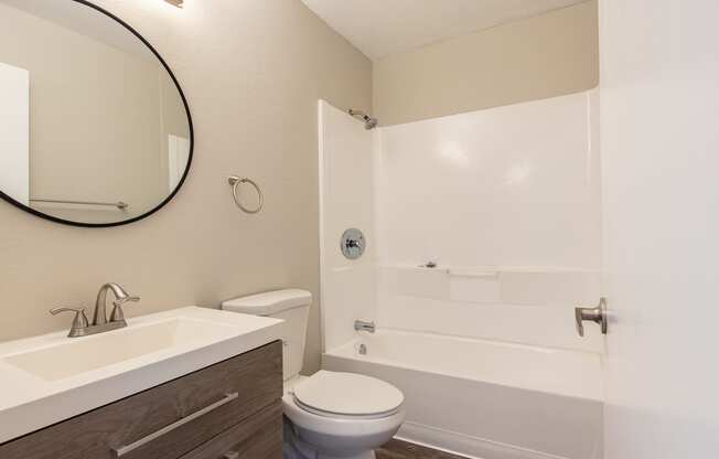 a bathroom with a toilet sink and bathtub