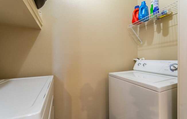 a small laundry room with a washer and dryer