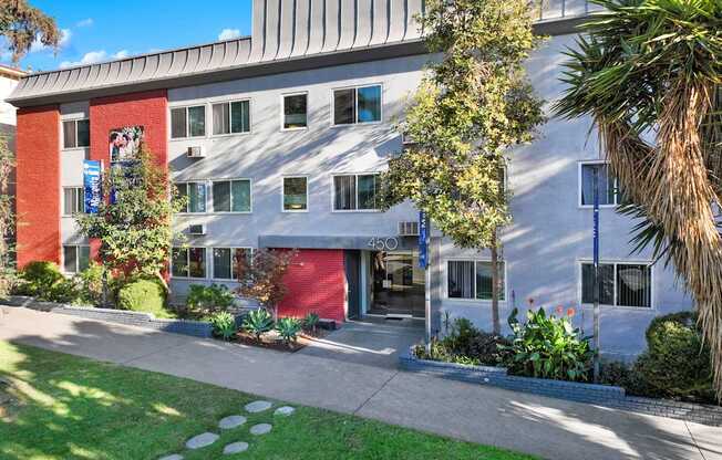 A building with a red brick wall and a sign that reads 450.