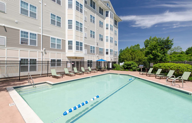 Pool with Lounge Chairs and Umbrellas | Canton Woods