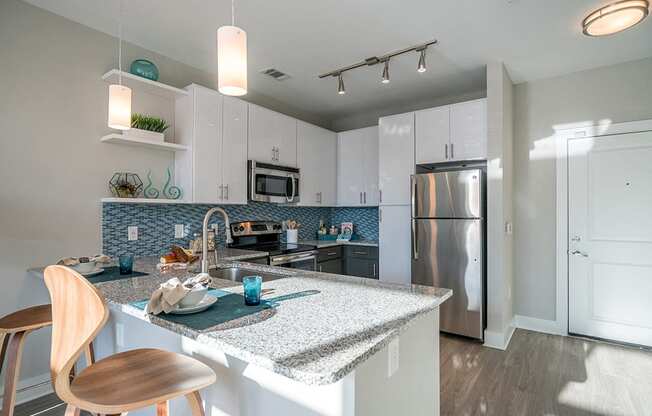 Fitted Kitchen With Island Dining at Link Apartments® Glenwood South, Raleigh, NC, 27603