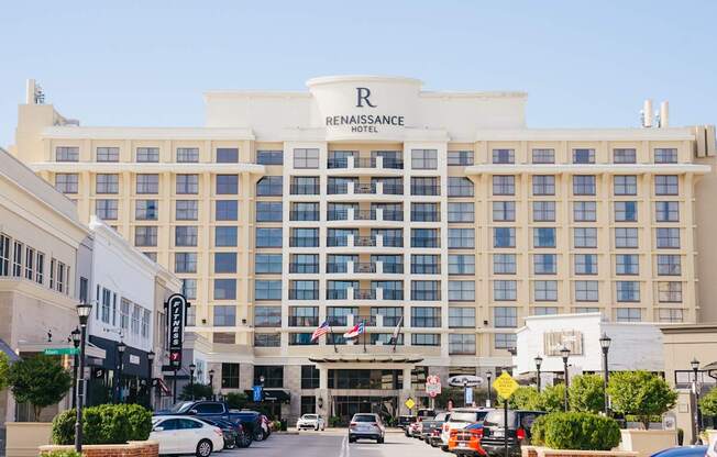 The Renaissance Hotel is a large, white building with a lot of windows.