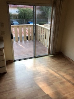 Interior photo of slider in kitchen leading to balcony