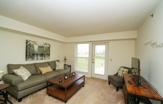 Carpeted Living Rooms at Tracy Creek Apartment Homes, Ohio 43551