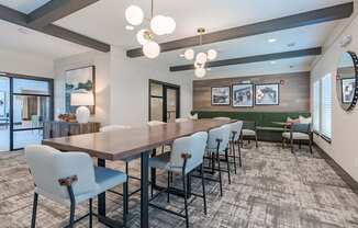 a conference room with a long wooden table and chairs