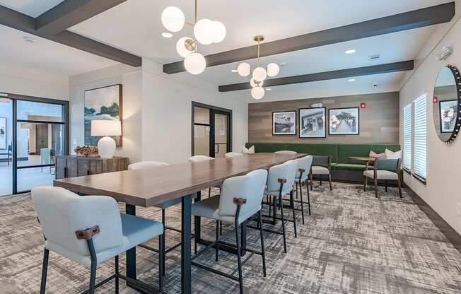 a conference room with a long wooden table and chairs