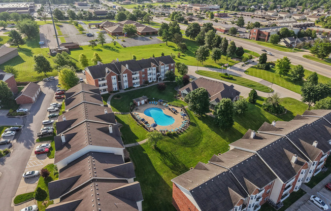 Aerial view of Kelly’s Ridge, showcasing the pool, clubhouse, and vibrant community setting.