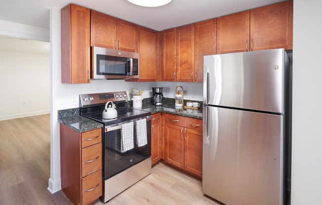 Bright and bold. Our Sterling kitchen updates include designer lighting and premium stainless steel appliances.