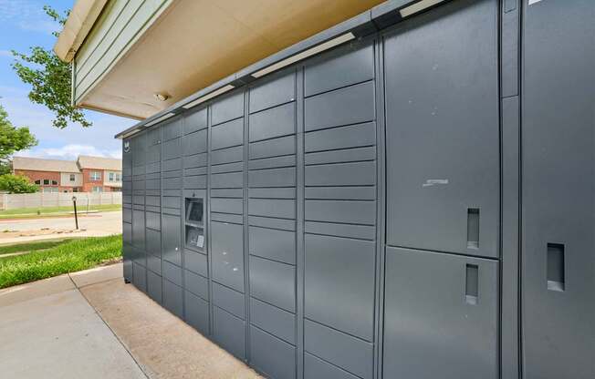 A grey storage unit with a door and a small window.