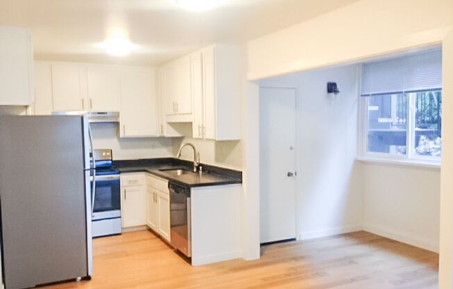 Stunning Remodeled 2BR/2BA Flat! Fireplace! Parking! Laundry! -PROGRESSIVE