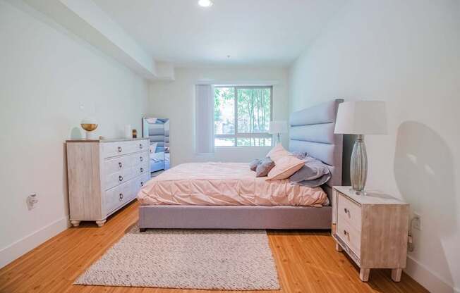 A bedroom with a bed, nightstand, and dresser at Woodley Sara Apartment, Van Nuys