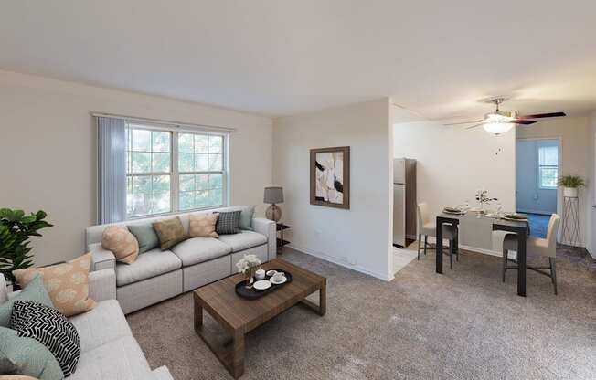 living area with sofa, coffee table, windows and view of dining area at manor village apartments in washington dc