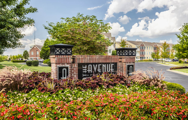 the preserve at gateway sign with flowers and buildings in the background