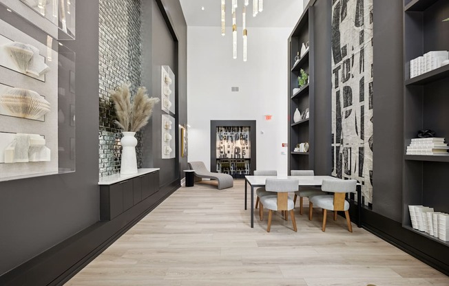 A modern interior with a long table and chairs.