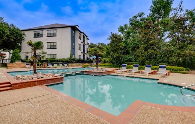 our apartments have a resort style pool with lounge chairs