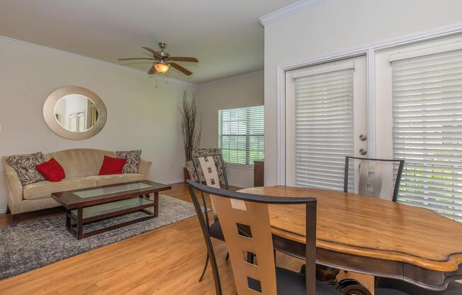 a dining room table in front of a window