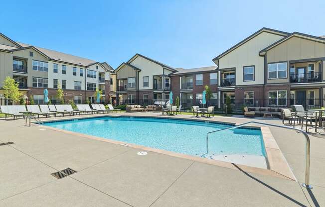 Austin Park Apartments Miamisburg Ohio Pet Friendly Amenity Resort Style Swimming Pool and Sundeck with Shaded tables and lounge chairs